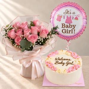 Rosy Embrace pink roses with one Baby Girl balloon and a pink cake reading Welcome Baby Girl