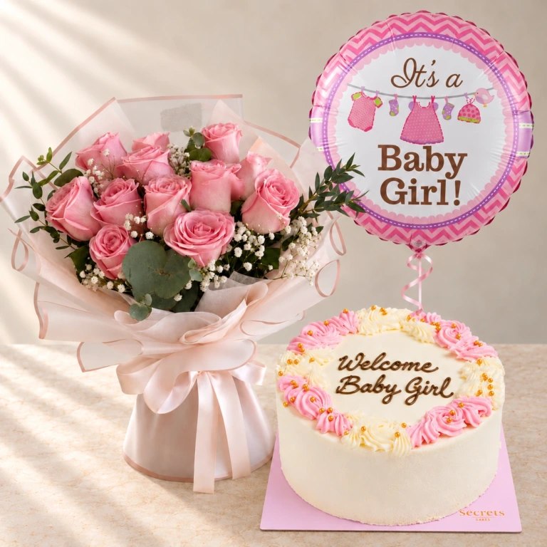 Rosy Embrace pink roses with one Baby Girl balloon and a pink cake reading Welcome Baby Girl